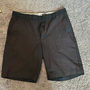 Greg Norman black golf shorts, size 34